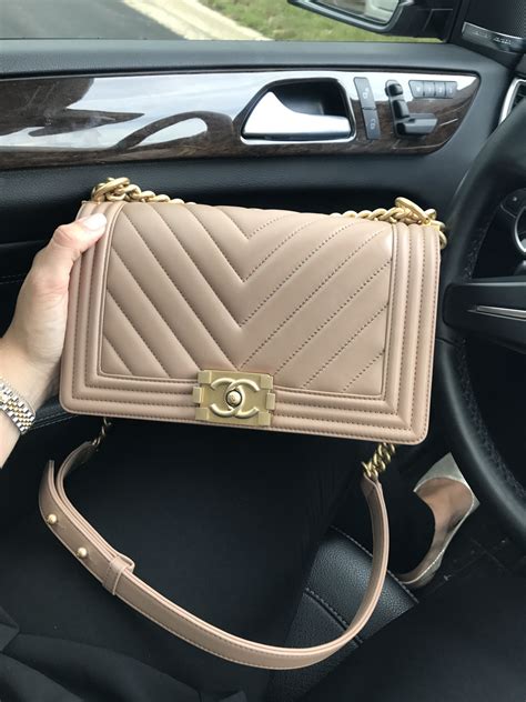 chanel beige meedium bag with black hardware|More.